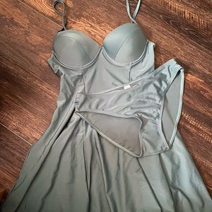 2 piece women’s swimsuit. Underwire. More of a teal shade.